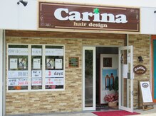 カリーナ ヘア デザイン(Carina hair design)の雰囲気（外から見たお店の入り口です。レンガ調の壁と茶色の看板が目印。）