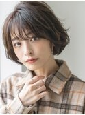 ニュアンスパーマとグレージュブラウンの抜け感丸みショートボブ