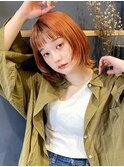 ジューシーなオレンジカラーが目を引くおしゃれウルフボブ
