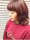 ジューシーオレンジカラーのミディアムウルフ