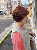 丸みシルエットのショートボブ×オレンジブラウン