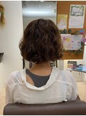 ミディアムへアの可愛らしいパーマ