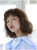 ゆるいパーマの切りっぱなしボブ