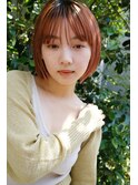 オレンジカラーが似合うミニボブ