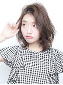風揺れるパーマスタイル