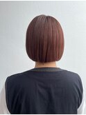 オレンジピンクカラーのミニボブ