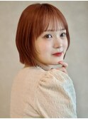 コーラルオレンジ 顔周りレイヤー ラウンドバング 切りっぱなし