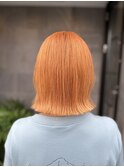 ワンブリーチのオレンジカラー×くびれボブ