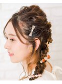 大きなリボンが可愛い。編み込みハーフアップ