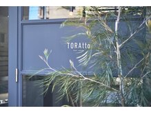 トラット(TORAtto)の雰囲気（こだわりの鉄製ドアのエントランスが大切なお客様を特別空間へ）