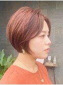 オレンジカラーの丸みショートヘア