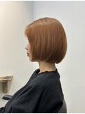 オレンジのムヌーディカラーに小顔ボブ