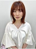 オレンジカラーと顔まわりのデザインカット