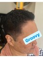 グルービー(Groovy) 周り刈り上げスタイルトップにアイロンパーマバックスタイル