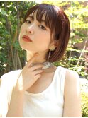 コンパクトなシルエットと束感が可愛いオレンジショートボブ