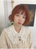 オレンジカラーのパーマボブ