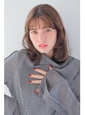 フェミニンセミロングゆるふわカール眉上薄めバング