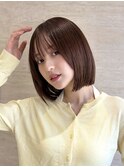 外ハネパツっと切りっぱなしレイヤーボブタッセルボブ丸顔面長
