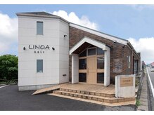 LINOA hairの雰囲気（レンガと木目調をいかした温かみのるサロン）