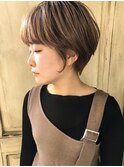 オレンジベージュのラウンドショート