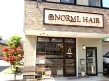 ノーマルヘアー(NORML HAIR)の雰囲気（金石街道交差点角にあります。お店前と裏に駐車場あり。）