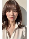 ソフトな巻きのロングヘア