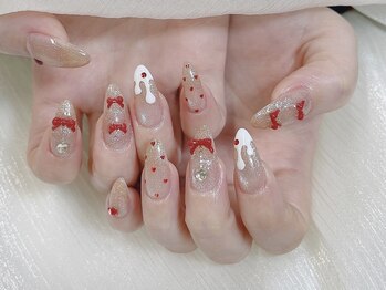 垂れ白チョコに赤リボンネイル