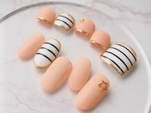 カトルナフ(quatre fois neuf)/オレンジカラーのお揃いネイル