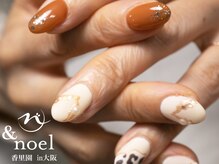 ノエル(Noel)/牛柄 × オレンジネイル