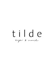 tilde (eye and nail)