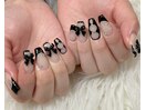 個性派ネイル・黒フレンチリボン