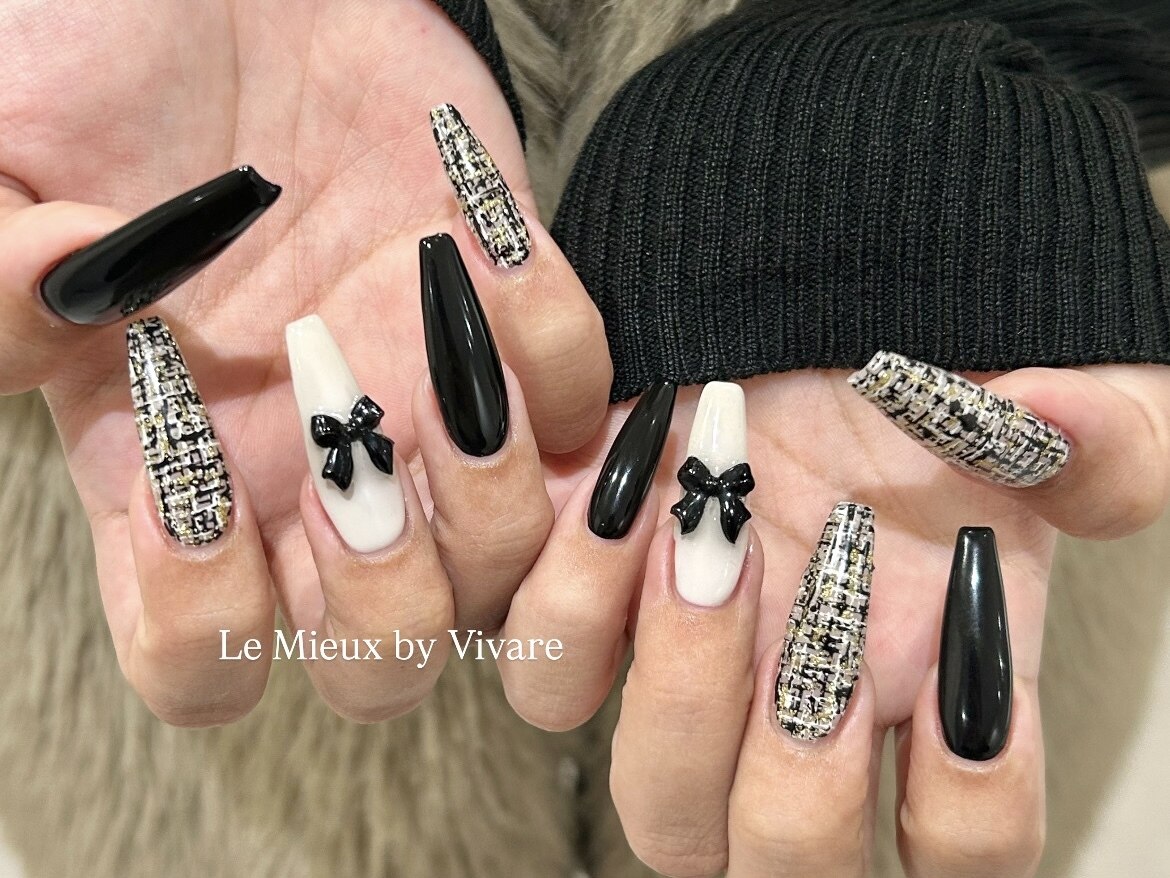2025年-2026年冬トレンド】ブラック リボン ハンドのネイルデザイン集