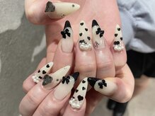 プロテア(protea)/黒フレンチ×リボンパーツネイル