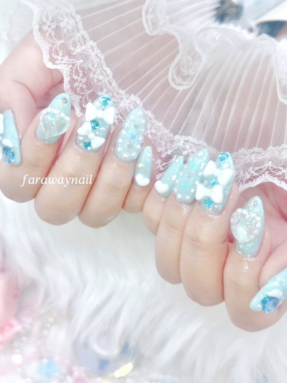 2025年-2026年冬トレンド】ブルー リボンのネイルデザイン集｜人気順