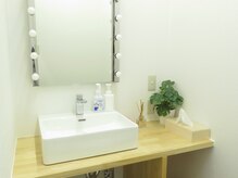 ファング 東武練馬店(FANG)の雰囲気(緑のワンポイントで新鮮な感じのある更衣室)