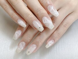 指先に絡むようなリボンネイル