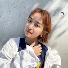 センターパートのニュアンスボブ×ピュアオレンジ