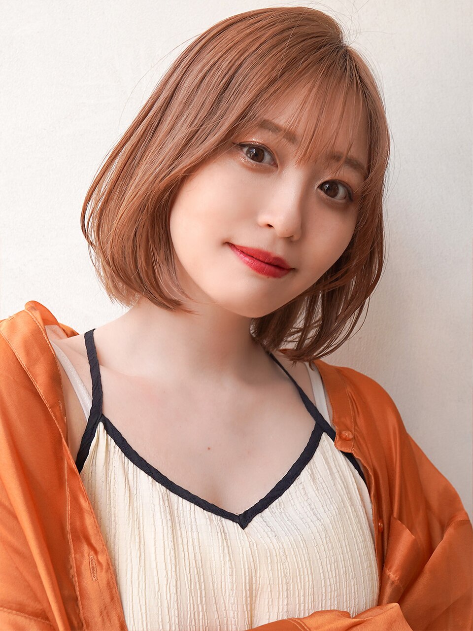 オレンジベージュ×丸みボブスタイル