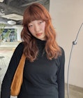 オレンジベージュフレンチバングミディアムレイヤーブリーチ